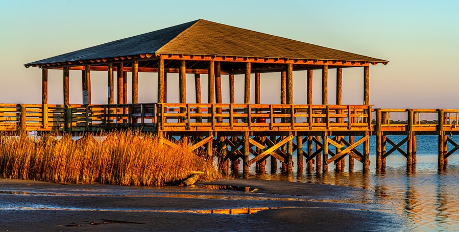 Pier plus covered picnic areas on the Gulf in Long Beach Mississippi area, late light.