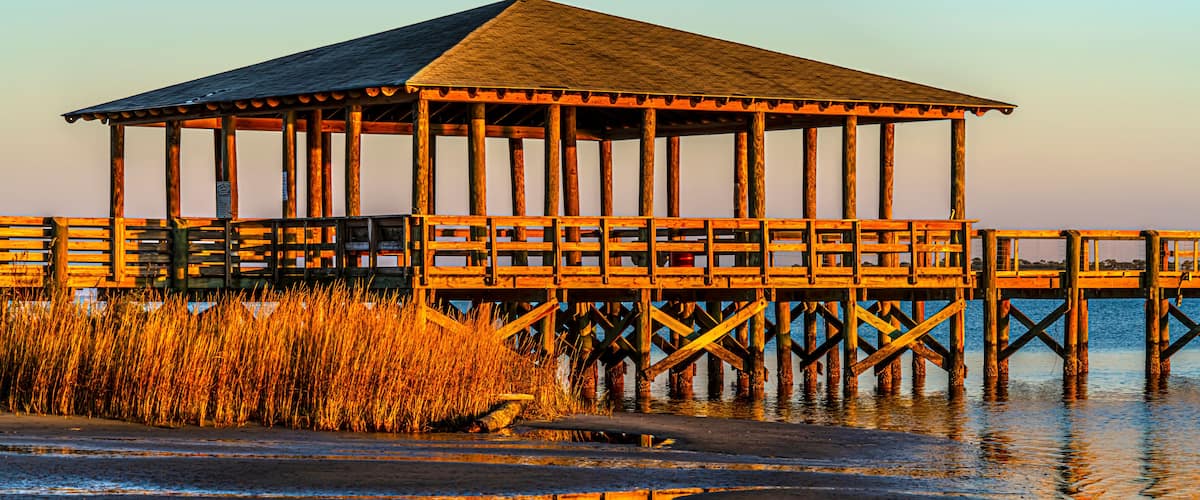 Pier plus covered picnic areas on the Gulf in Long Beach Mississippi area, late light.