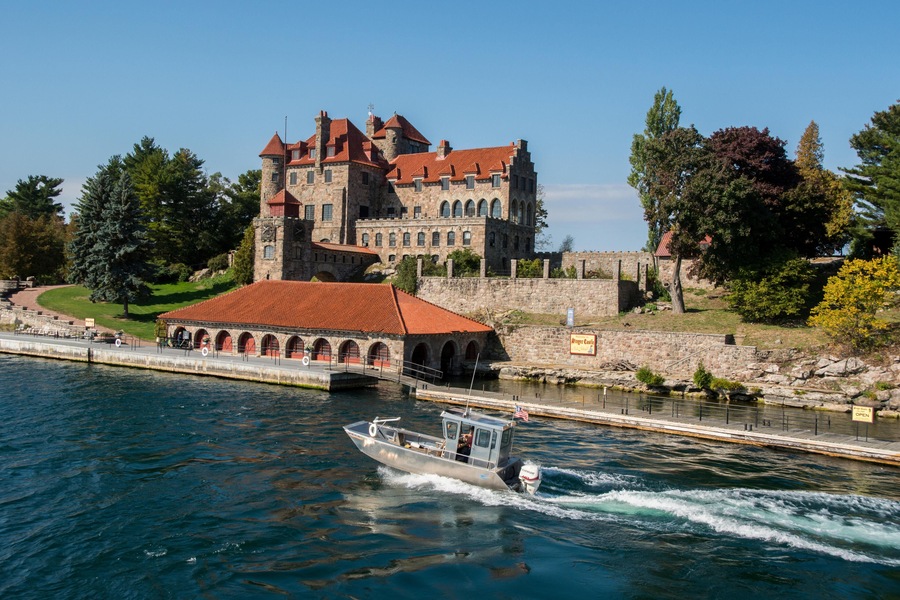 H81ENX New York, Chippewa Bay, Hammond, Dark Island. St. Lawrence Seaway view of historic Singer Castle and Boat House.