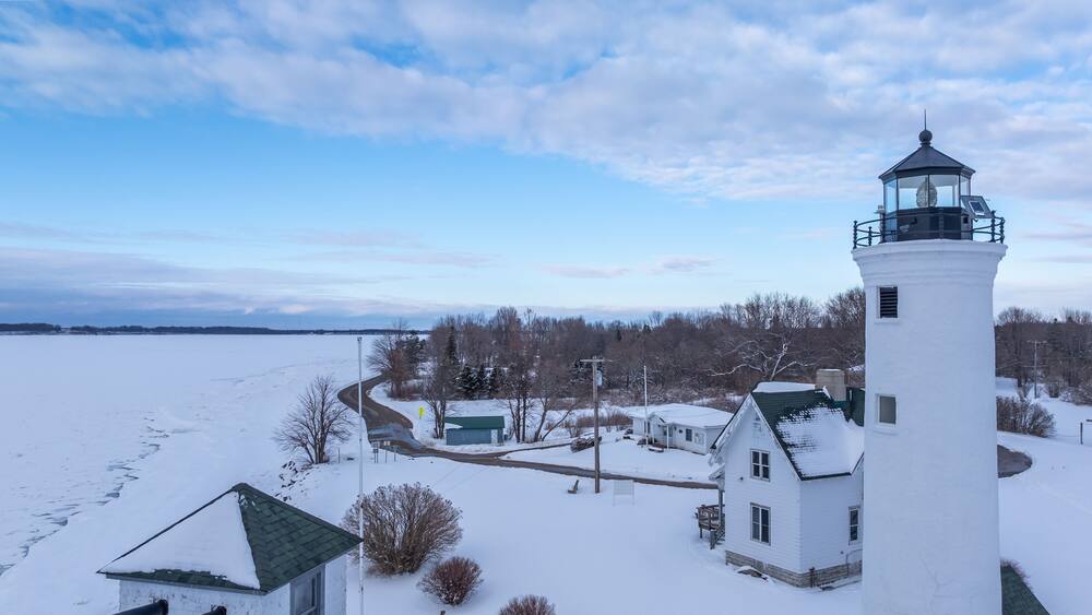 Winter aerial view Tibbetts Point Lighthouse on the shore of Lake Ontario, at the entrance of the St Lawrence River in Cape Vincent, New York.