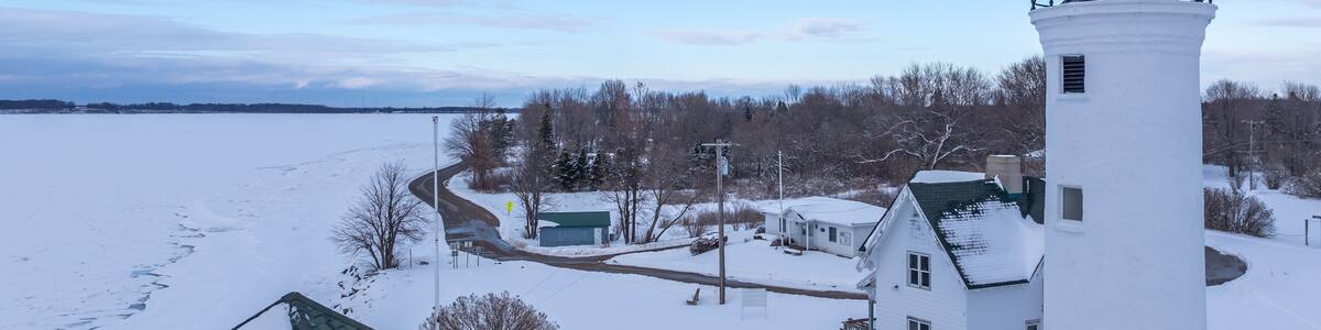 Winter aerial view Tibbetts Point Lighthouse on the shore of Lake Ontario, at the entrance of the St Lawrence River in Cape Vincent, New York.