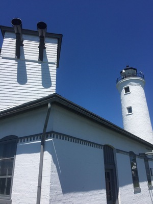 Looking at the Tibbitts Lighthouse from the foghorn building. The two foghorns are visible in the photo but are no longer in use.