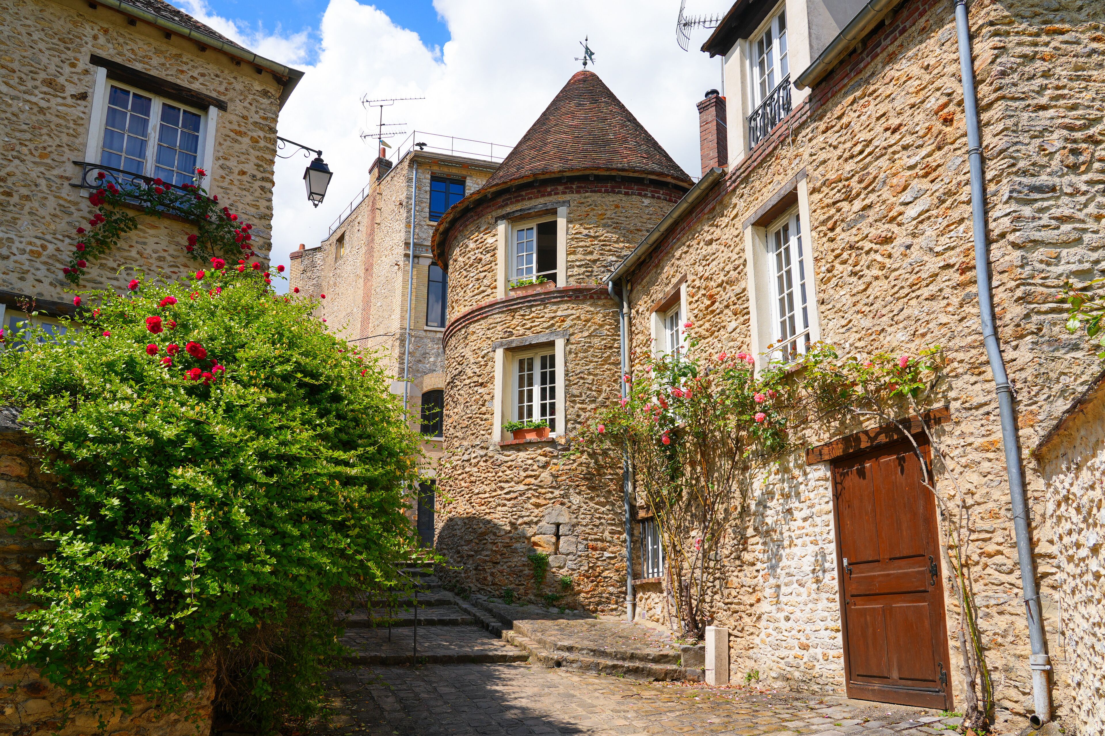 Medieval house with a round tower in Montfort-l'Amaury, a rural village of the French department of Yvelines in Paris region