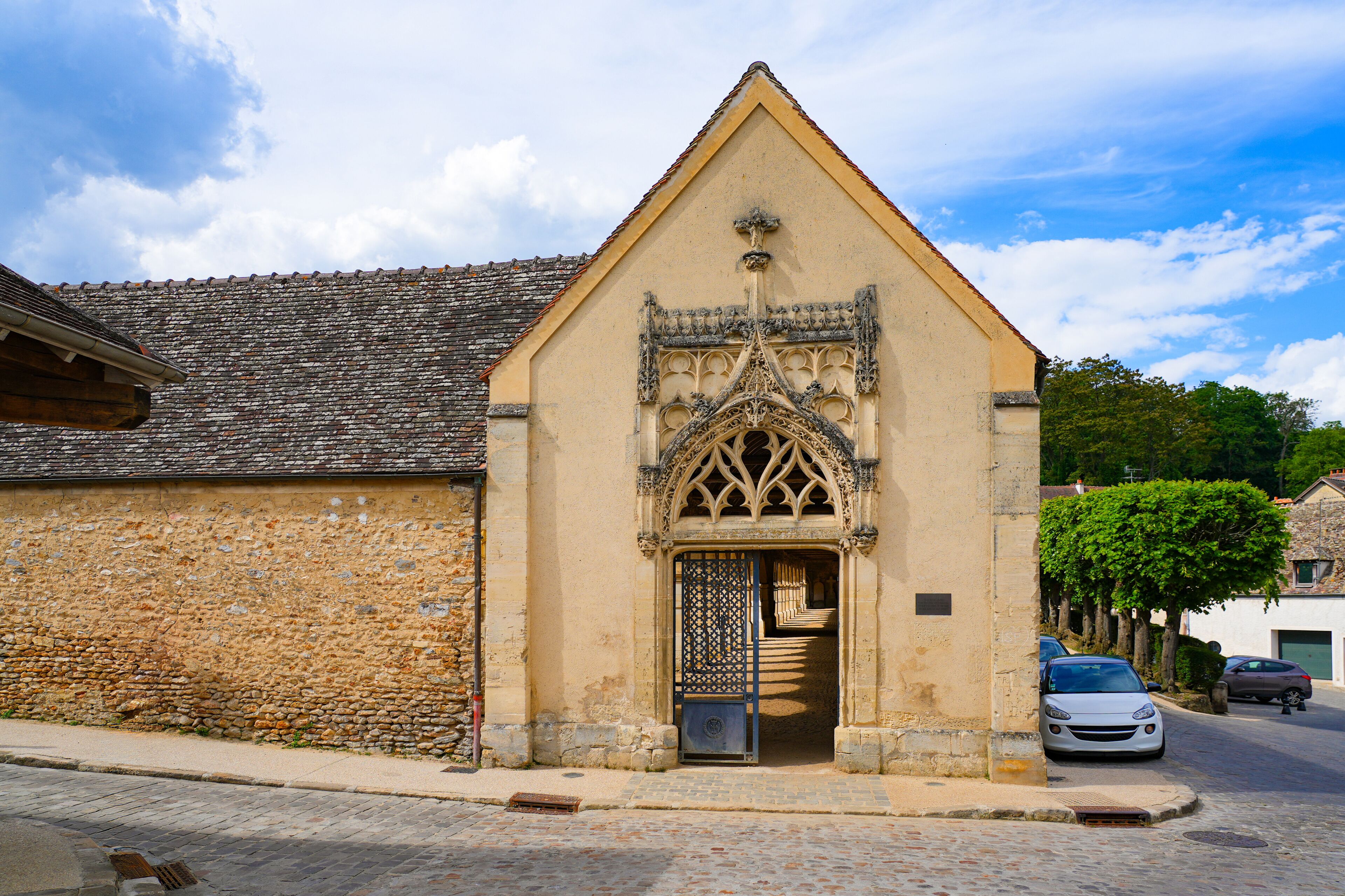 Gothic portal of the cemetery of Montfort-l'Amaury, a rural village of the French department of Yvelines in Paris region