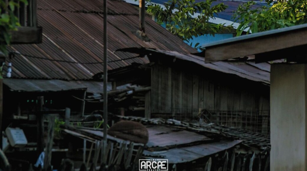 A golden temple rises over the slums of Hsipaw, Myanmar.