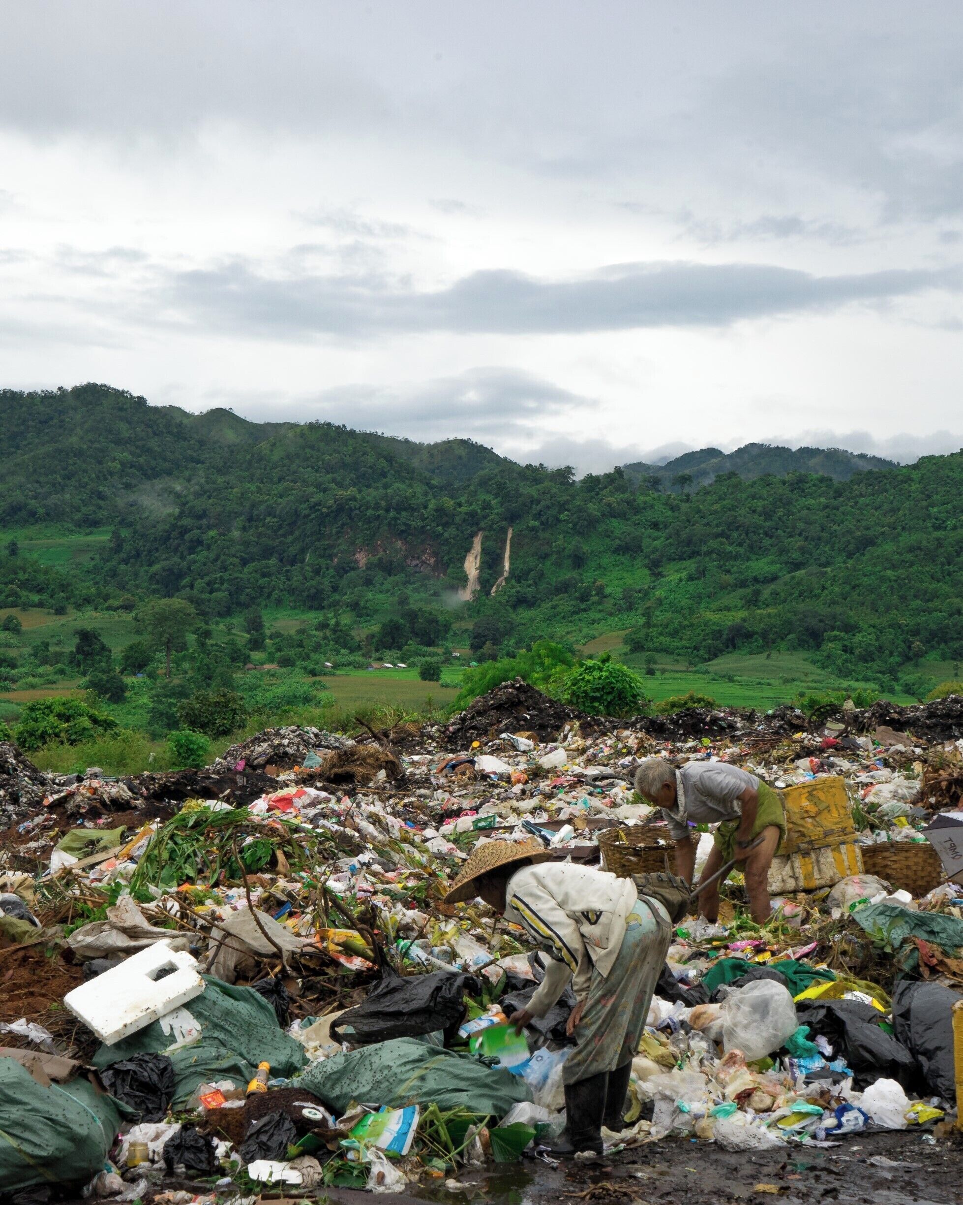 I set out to photograph the waterfall in the background, but instead it was this image that has been stuck in my mind ever since. An hour into the trek I came across this waste site with two locals searching for anything of value within the rubbish. It's was one of several I had seen throughout Myanmar but the contrast with the immense landscape surrounding it pressed home a harsh reality. Many people are making steps to reduce their own footprint on the planet and it's the easiest smallest, easiest things like saying no to plastic straws and having a reusable coffee cup that add up to reducing scenes like this all over the world.