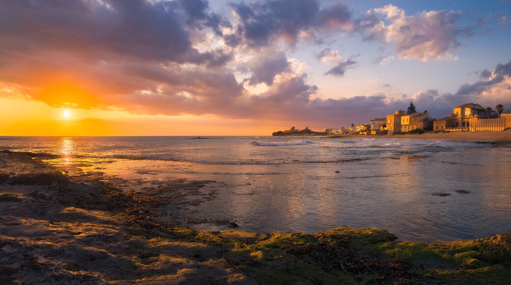 Vibrant Golden Sunset Over Punta Secca's Serene Sicilian Coast, Italia