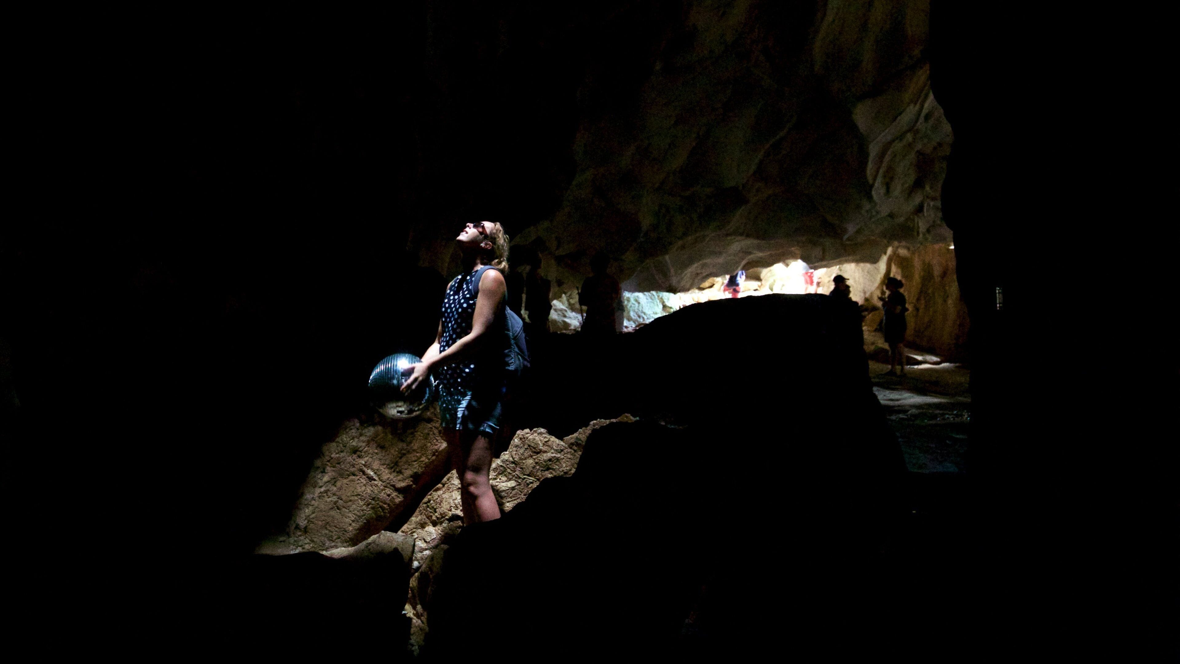 The Caves featuring caving and caves as well as an individual femail