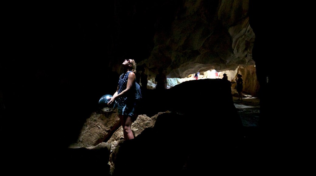 The Caves featuring caving and caves as well as an individual femail