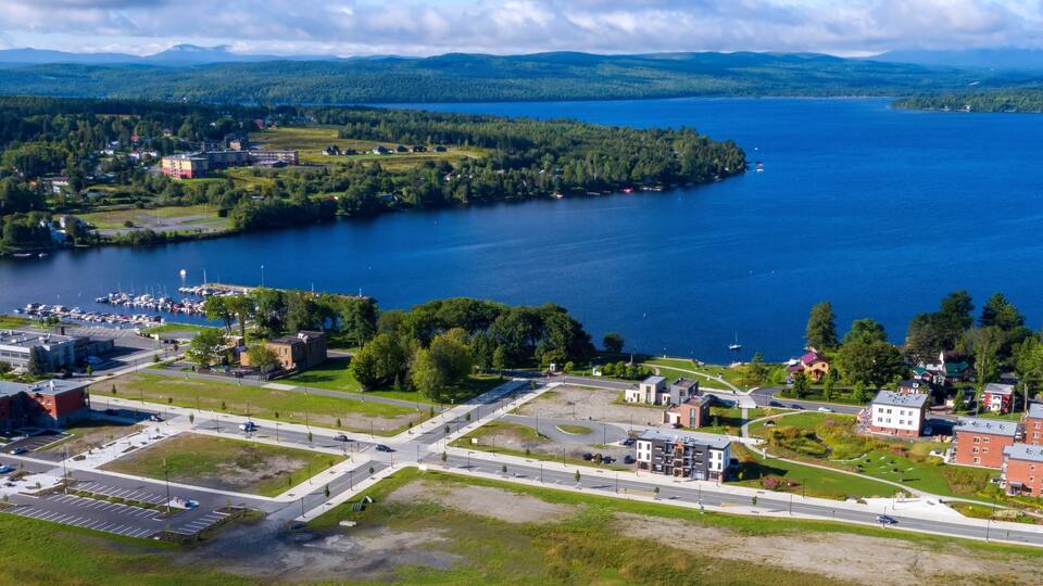 A lake surrounded by residential areas, a marina, and a road network.