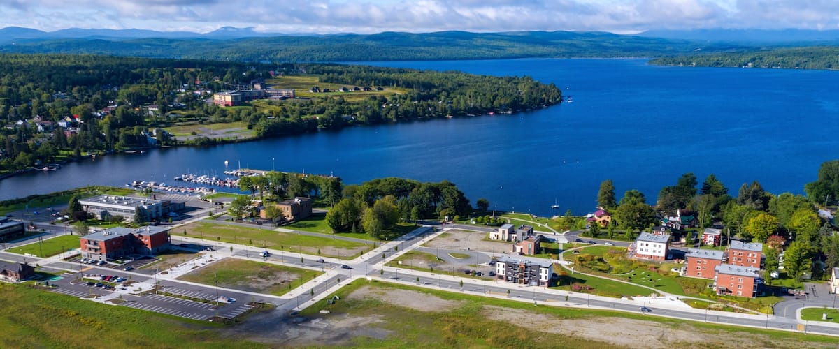 A lake surrounded by residential areas, a marina, and a road network.