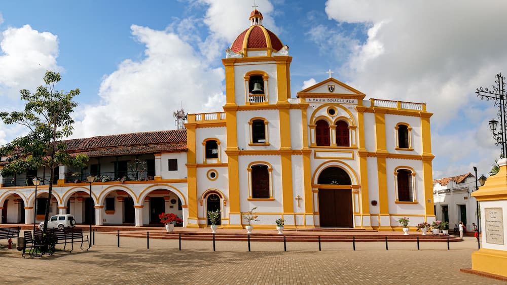 Panorama of Iglesia La Inmaculada Concepcion (church of the Inmaculate Conception), with cross in foreground, Santa Cruz de Mompox, World Heritage