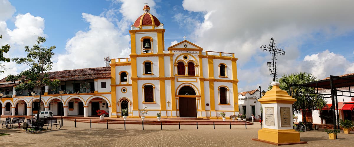 A historic church with a bell tower and arched windows.