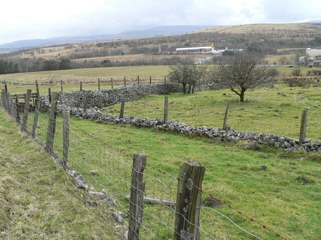 Field system - Hirgan Fields The photograph shows network of small fields with low stone walls topped by fencing that make up Hirgan Fields between Wells Farm and Hirgan Fach. This relict of small scale agriculture will be swept away when the A465 cuts through the area. In the near distance is Bryn Serth with Mynydd Carn y Cefn dominating the far horizon.