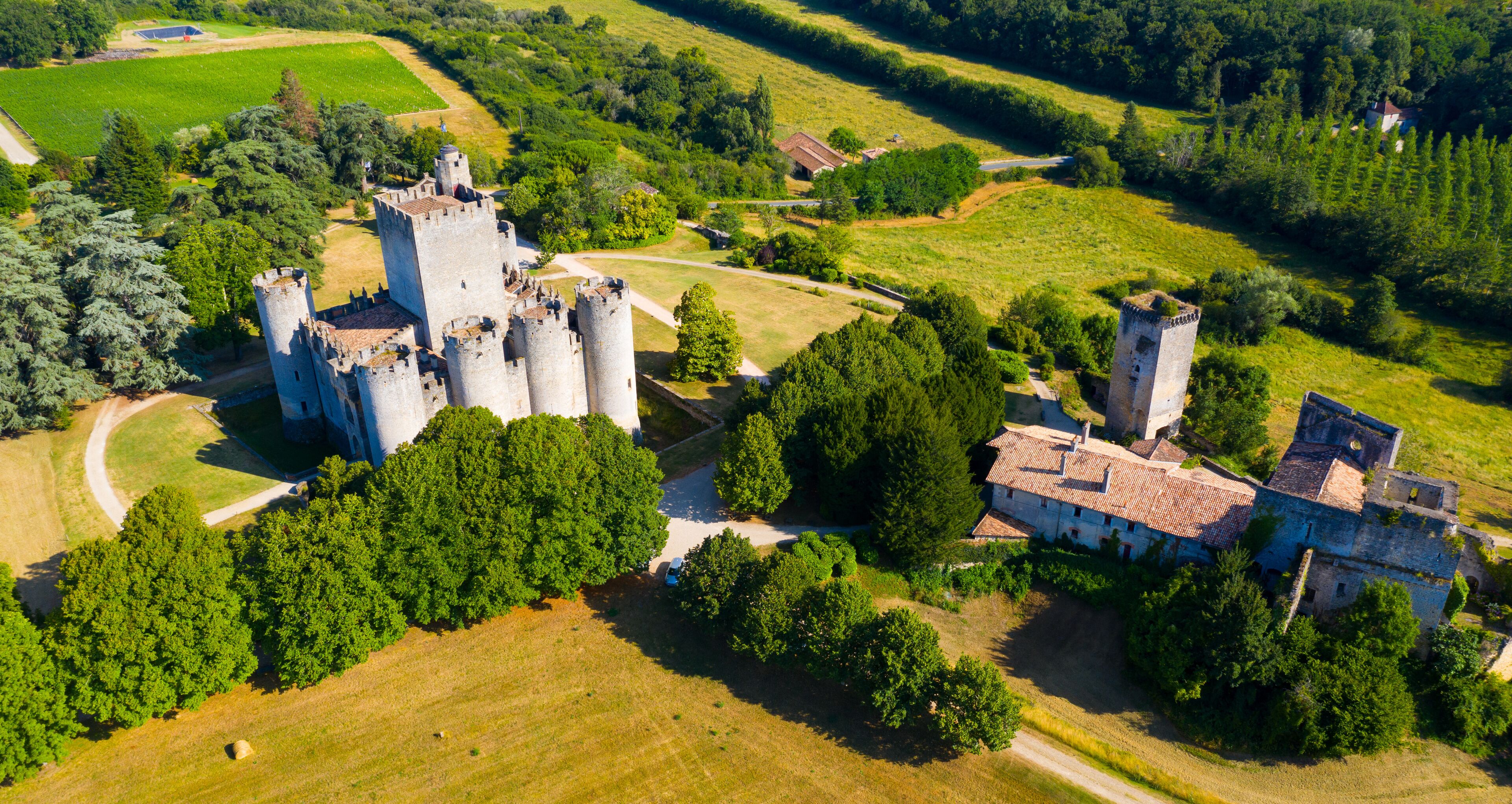 Summer view of medieval castle Chateau de Roquetaillade, Gironde, France