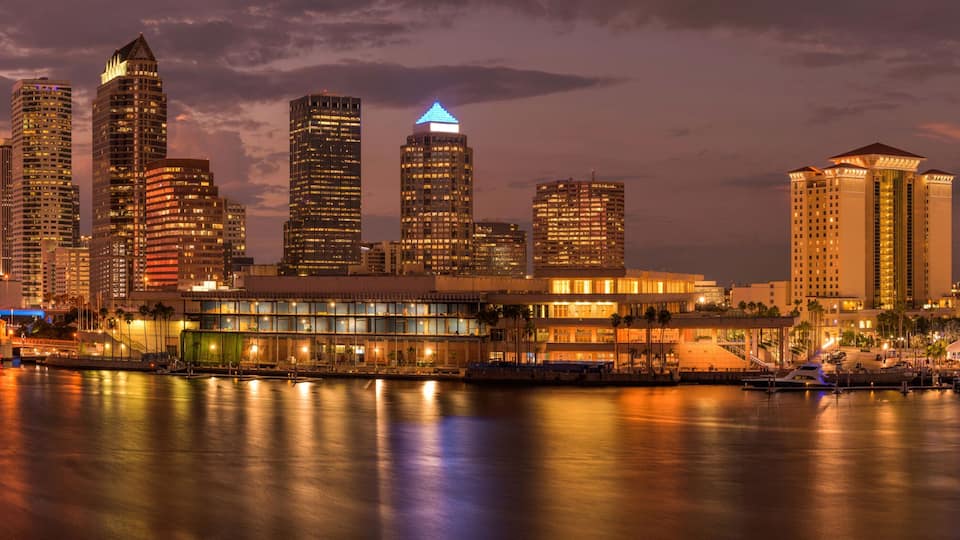 Tampa at Dusk - A panoramic dusk view of waterfront skyline of Tampa Downtown on a calm Summer evening. Florida, USA.