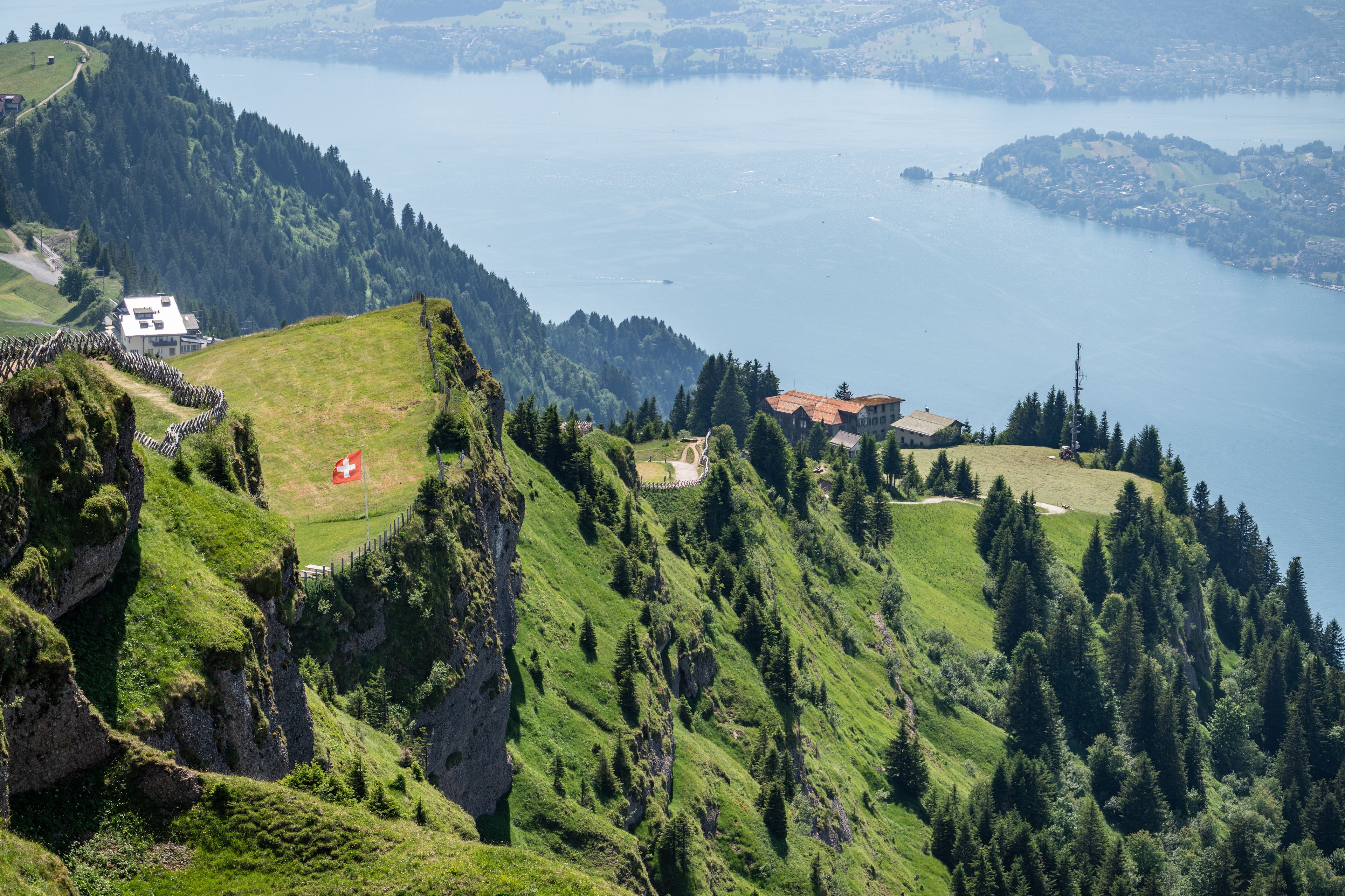 Rigi mountain landscape with swiss flag and lake lucerne