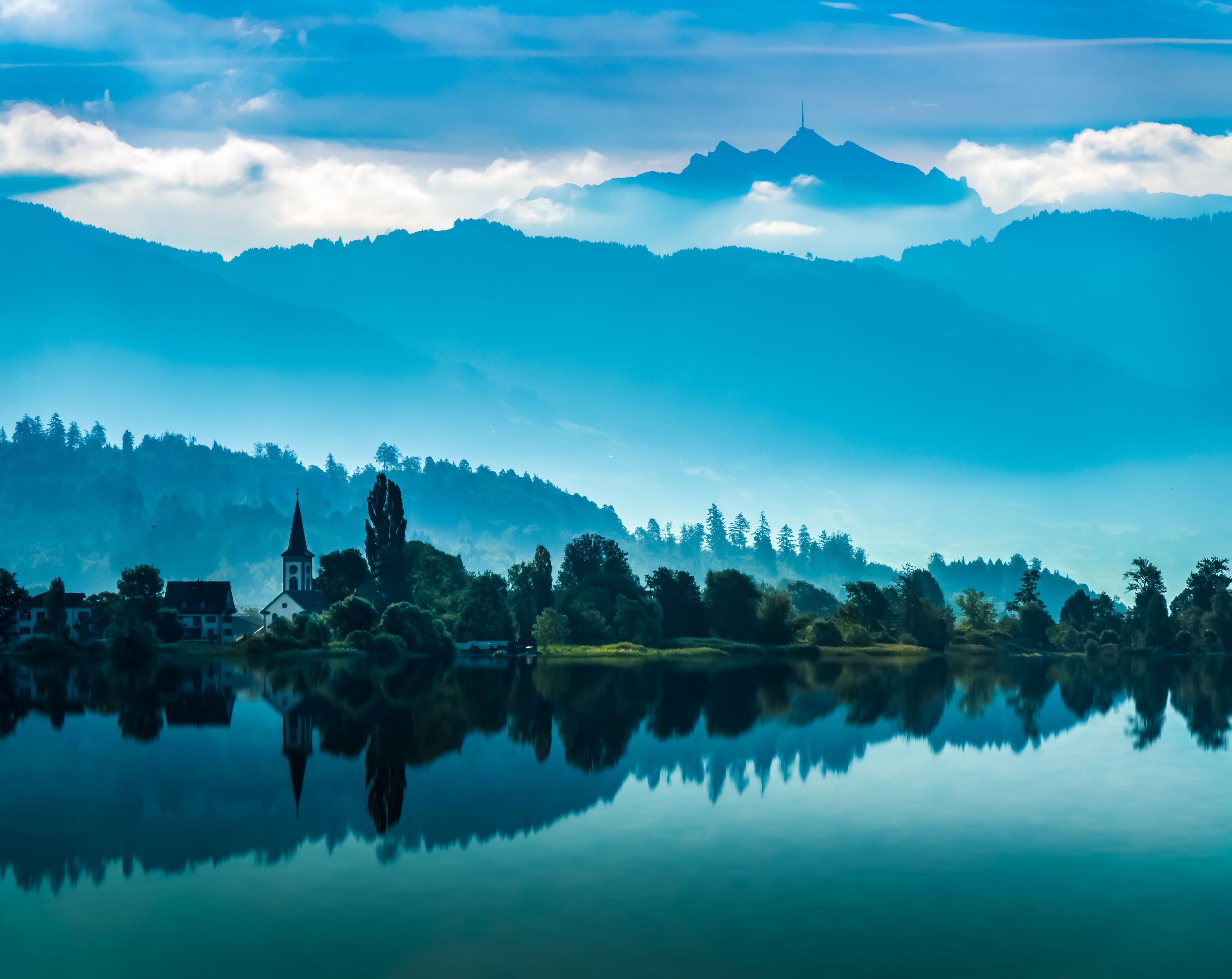 The charming village of Busskirch (Kirchdorf), Rapperswil-Jona, Sankt Gallen, Switzerland. Located in an idyllic lakeside shore of the Obersee (Upper Lake Zurich) .