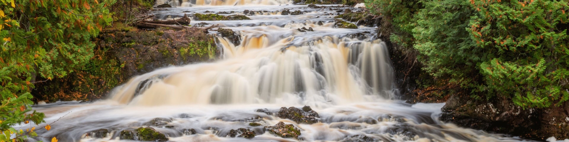 Water falls along Bad River at Copper Falls State Park during fall time