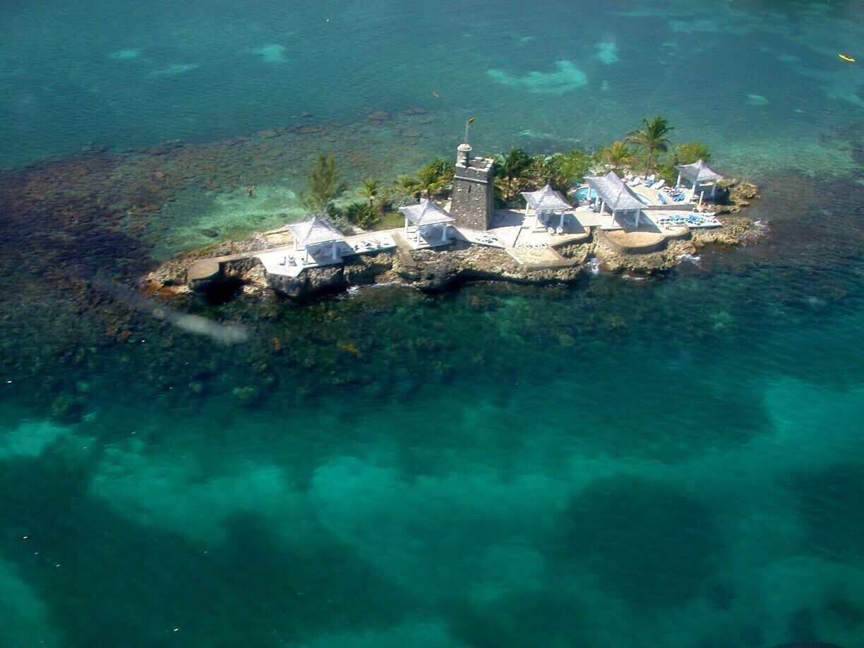 Sapphire Island view from our balcony at the Couples Ocho Rios couples only, all-inclusive resort. If you like to sun bathe au naturel, there is a boat to shuttle you to this island off the coast from the resort. Just far enough away for privacy. I think that weddings can be arranged to be performed on the island as well.

#waterlust