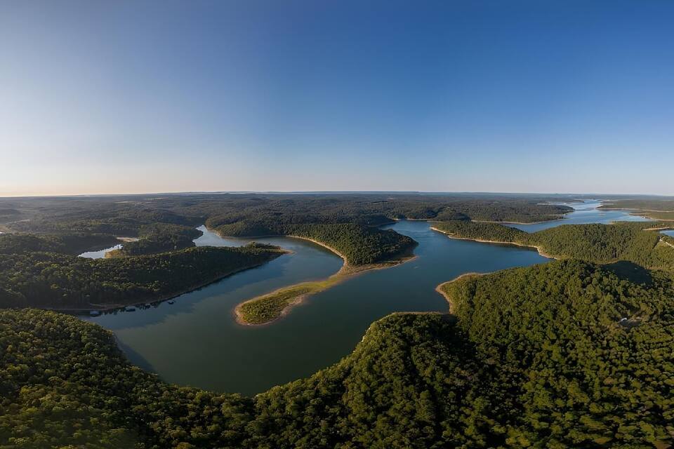 A river winding through a forested landscape with multiple lakes.