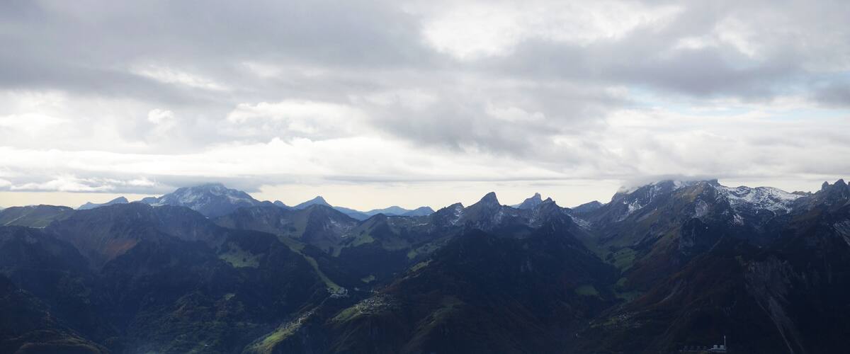 A mountainous landscape with rugged peaks and valleys.