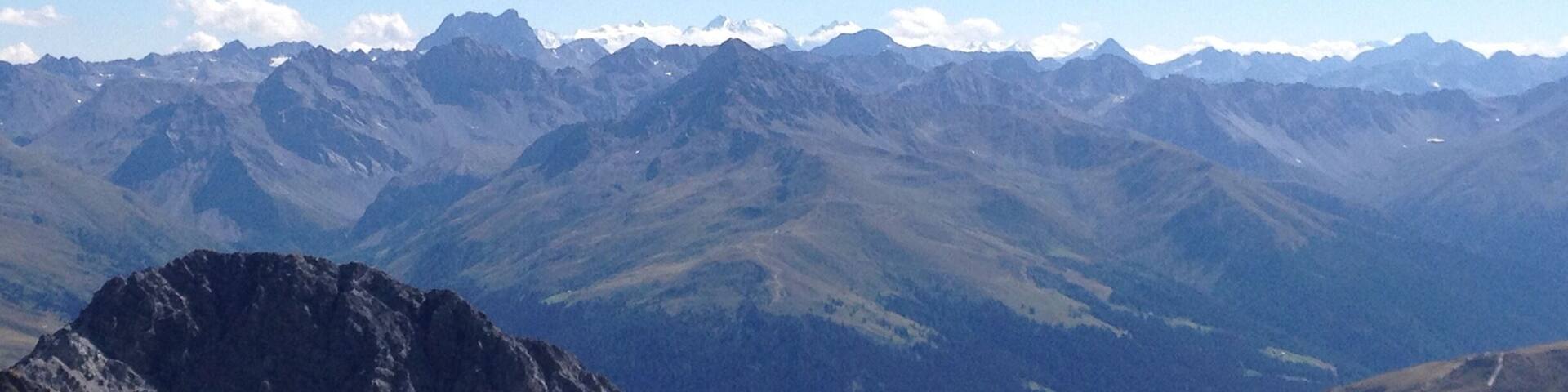 View from the Weissfluhgipfel end of August 2015. There are some alps in the distance that are still properly snow capped :)