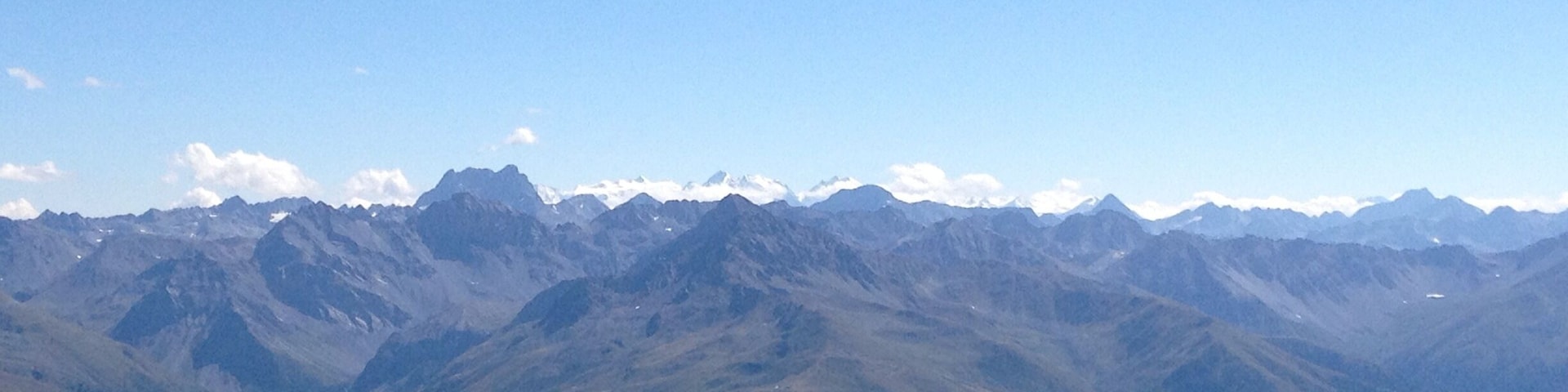 View from the Weissfluhgipfel end of August 2015. There are some alps in the distance that are still properly snow capped :)
