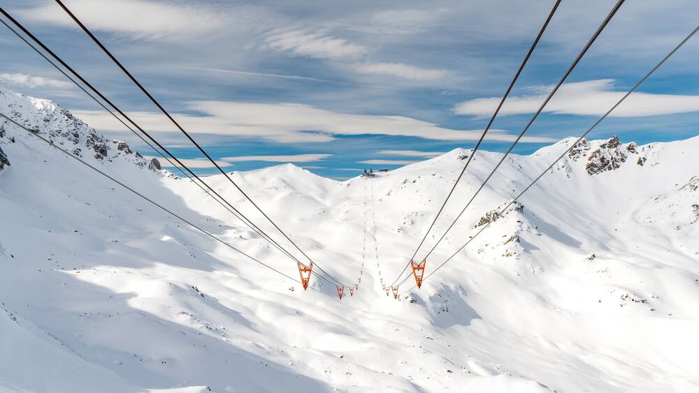 ski lift in arosa switzerland blue sky