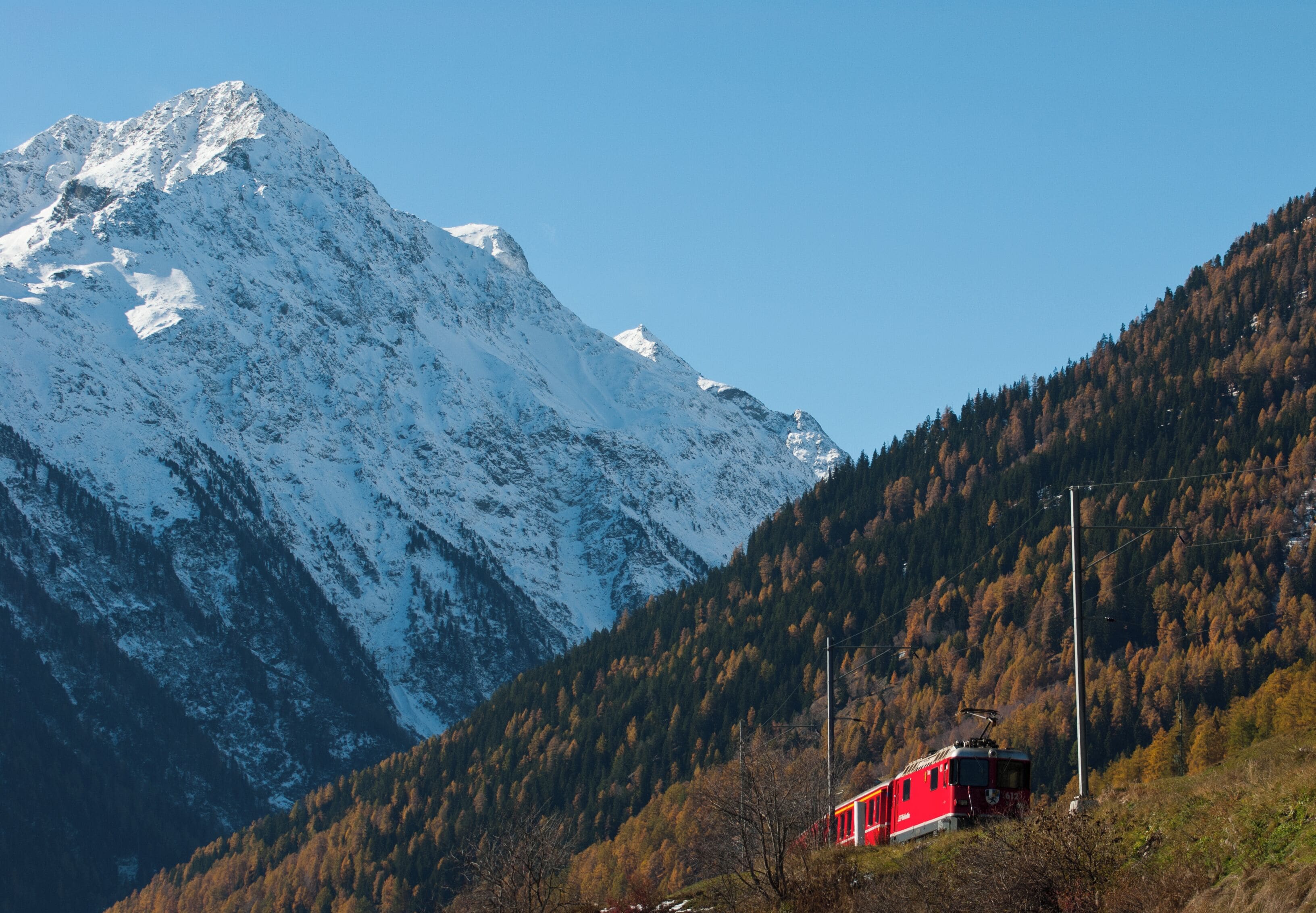 Piz dal Ras (3028m) from NE with train of the Rhaetic railway