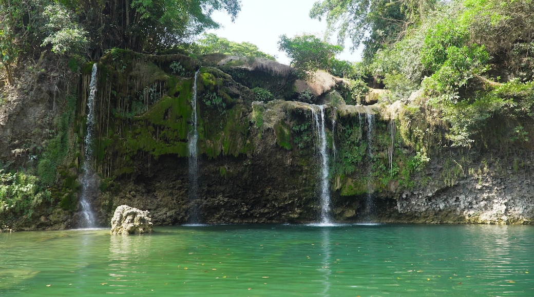 Waterfall in green rainforest. Bolinao waterfall in the mountain jungle. Philippines, Luzon. Travel concept.
