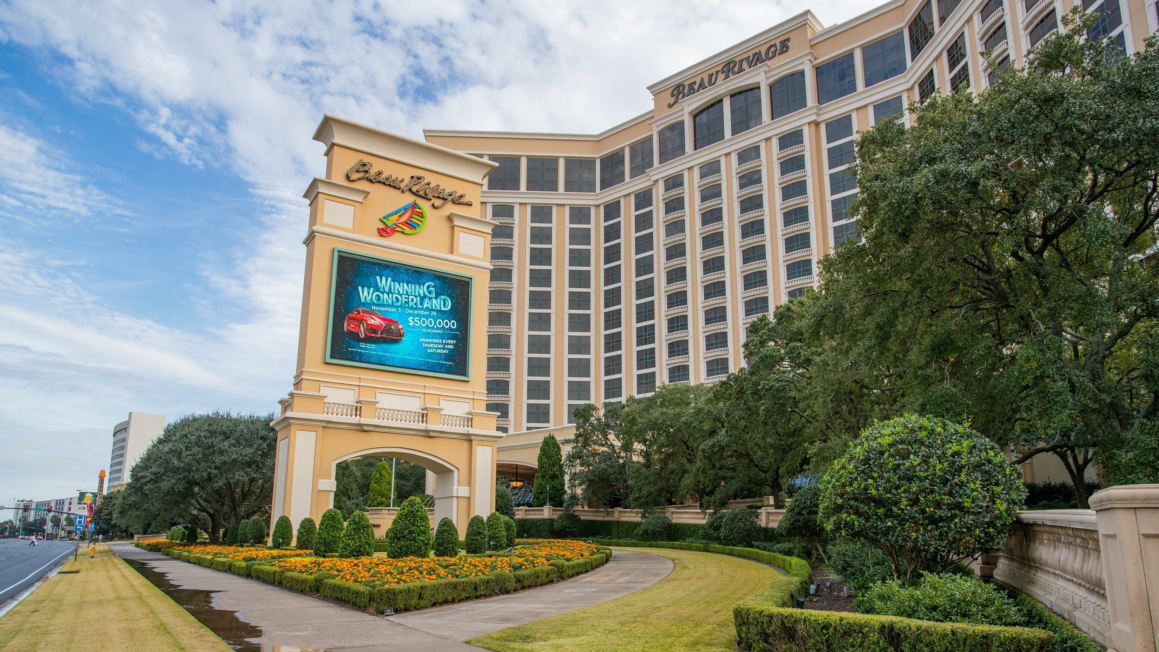 East Biloxi featuring a garden, a hotel and signage