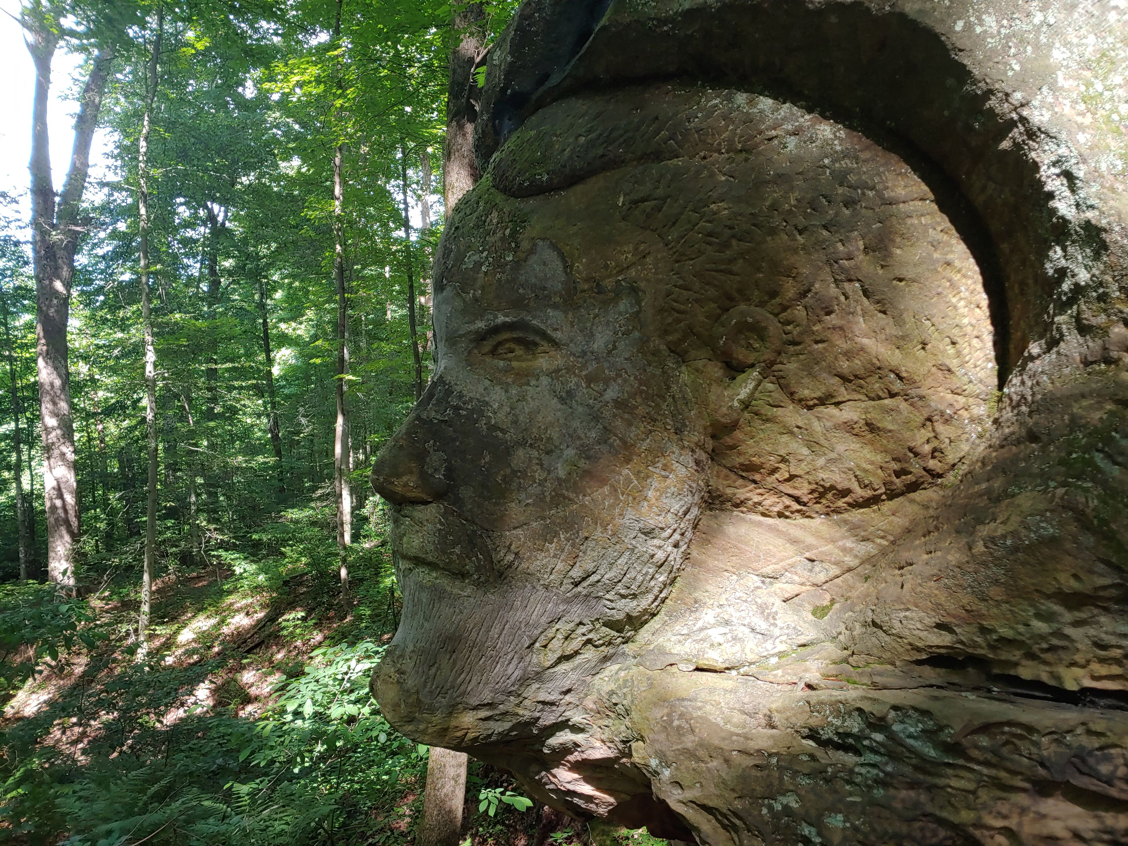 The trail at Worden's Ledges, named after land owner Hiram Worden, holds some unusual surprises upon its sandstone walls.

In the 1940's, Hiram's son-in-law, Noble Stuart, took his hobby as an amateur sculptor into the woods to create a menagerie of works that remain today.

This might be Hiram Worden immortalized in limestone in his old backyard