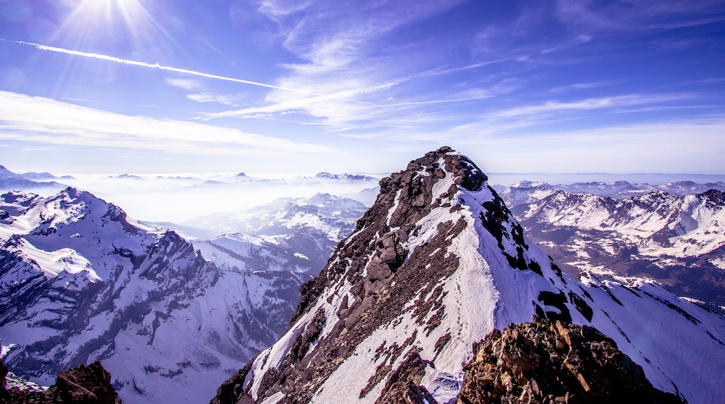 Alpine landscape with peaks covered by snow