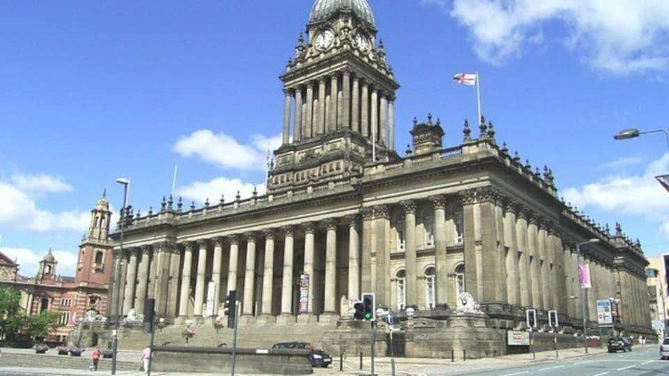 A large, historic building with a prominent dome and columns.