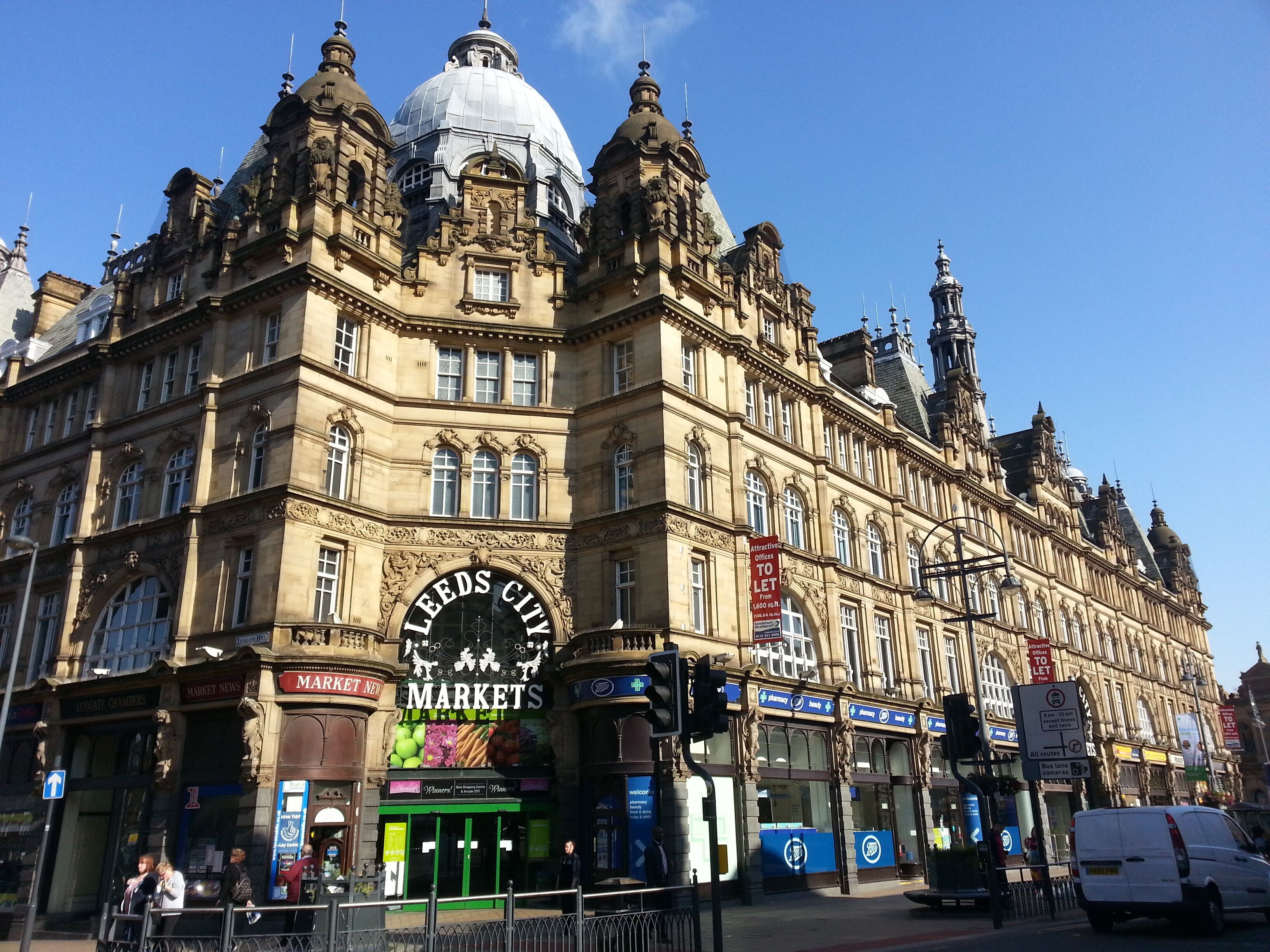 A historic building with ornate architecture, including a large dome and multiple spires.