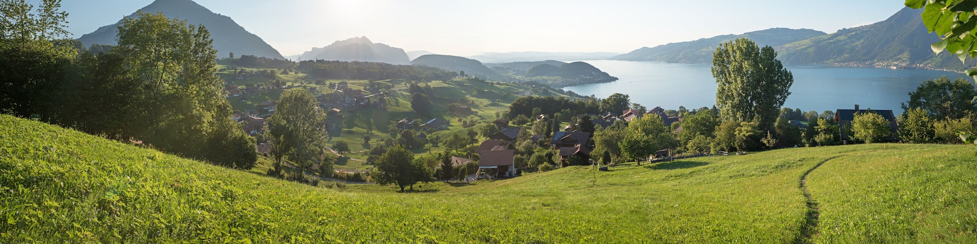 idyllic landscape tourist resort krattigen with view to lake Thunersee and Niesen mountain