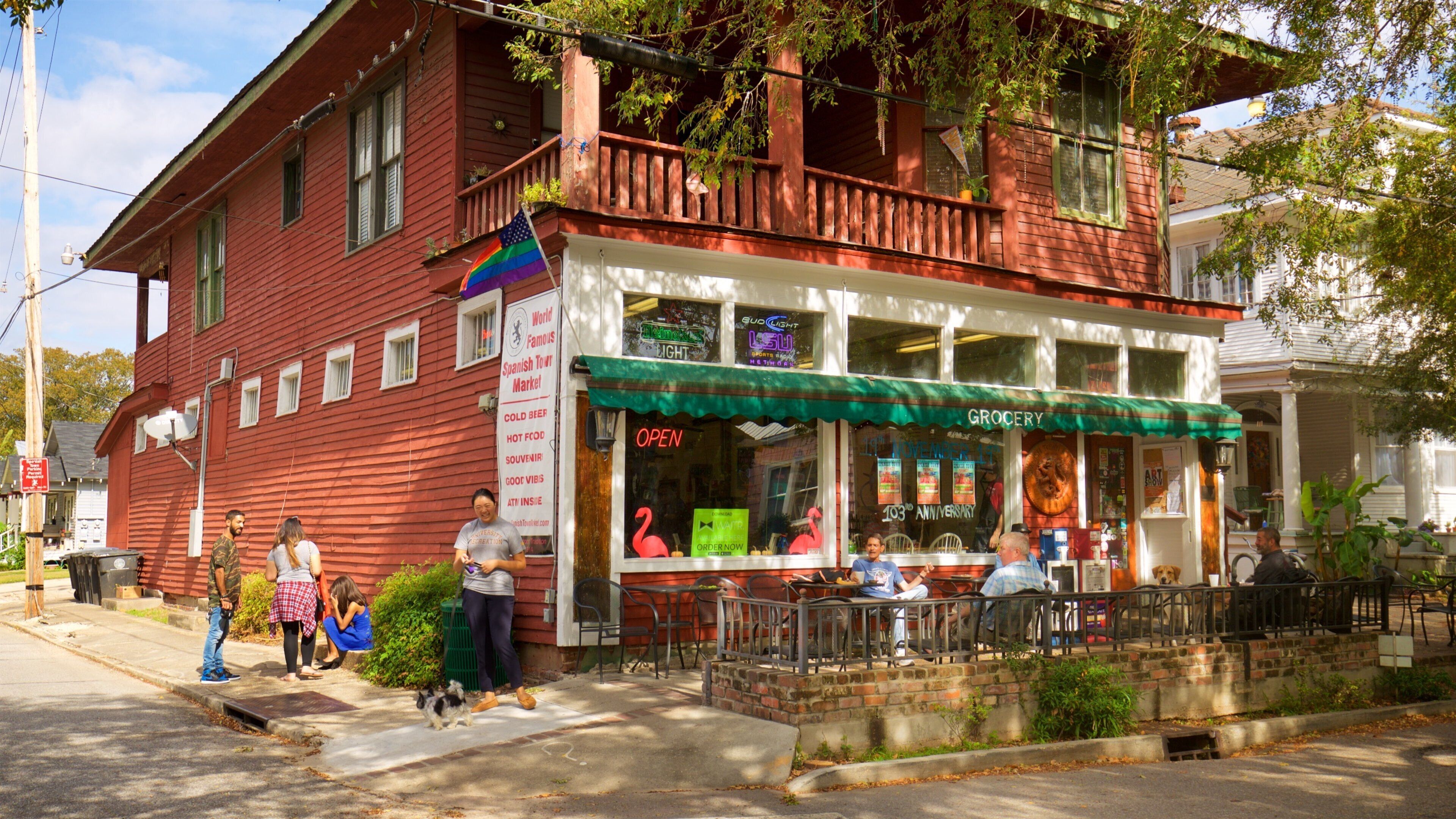 Spanish Town Historic District showing café lifestyle and outdoor eating as well as a small group of people
