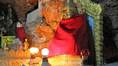 A pleasant walk through the mountain town of Kalaw brings you to Shwe Oo Min Paya, a series of caves filled floor to ceiling with buddha statues, lights and scribblings.
It's not a hard walk to do - simply state your destination to any local nearby and they'll point you on your way until you reach the spot! #red