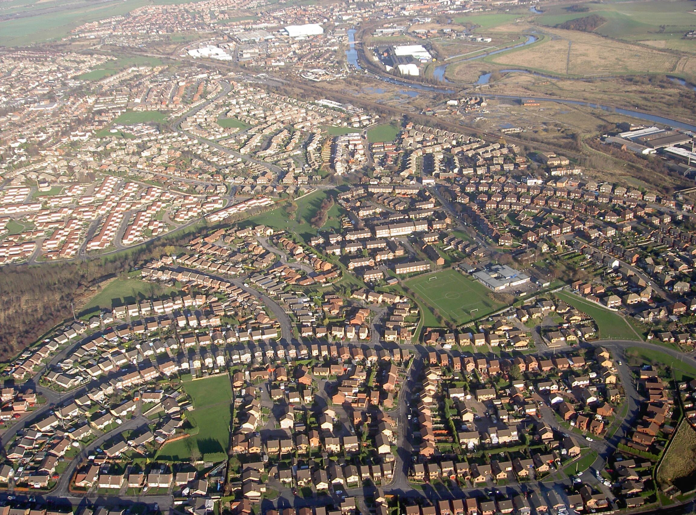 Wentworth Parks Estate Almost all of the estate showing Celandine Rise from left to right the road drops steeply but cannot be seen from the air photo, middle right standing out well is the playing field of Saint Thomas junior & infant school, upper right shows the LNER railway, canal & river Don all close together.