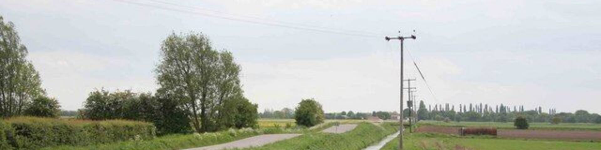 Road and ditch alongside each other Looking from the Wroot road southwards.