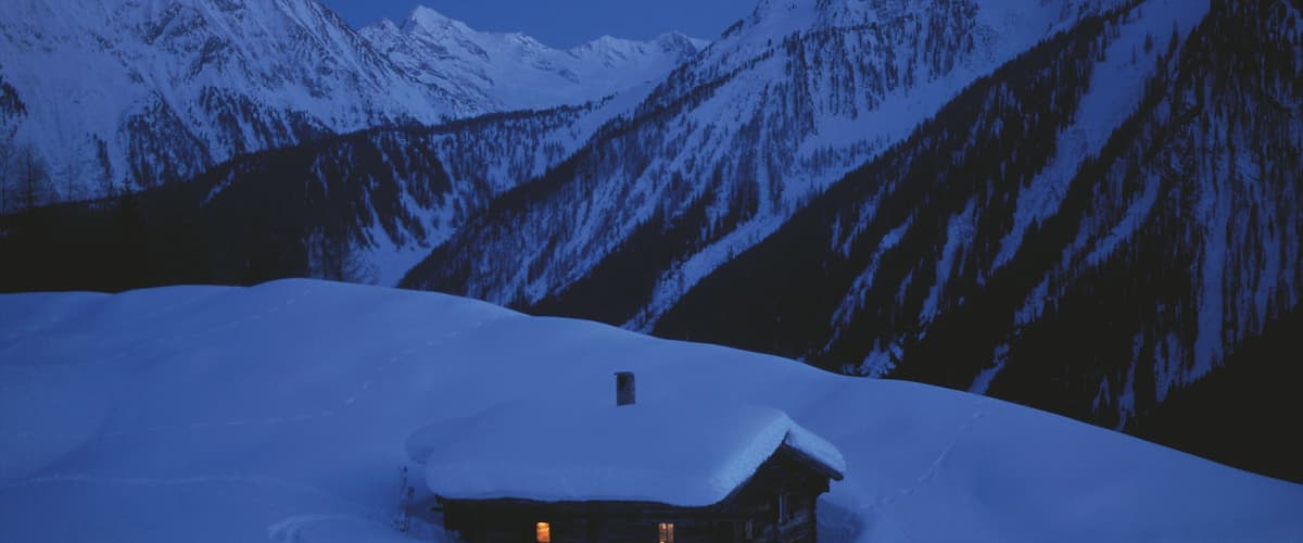 Mayrhofen featuring snow, a house and night scenes