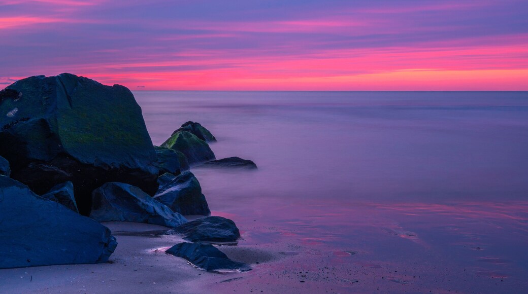 Colorful sunrise over Ocean Grove beach in New Jersey. Shot using slow shutter speed