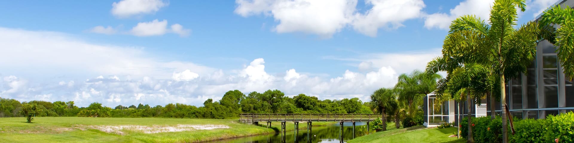 Freshwater canal at the rear of residential homes in Rotonda, Florida on a bright sunny day; Shutterstock ID 151134359