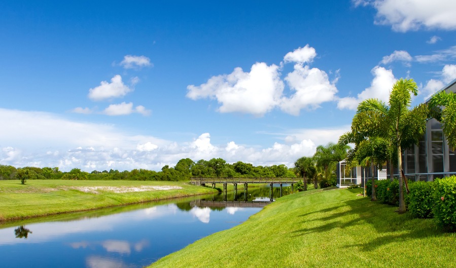 Freshwater canal at the rear of residential homes in Rotonda, Florida on a bright sunny day; Shutterstock ID 151134359