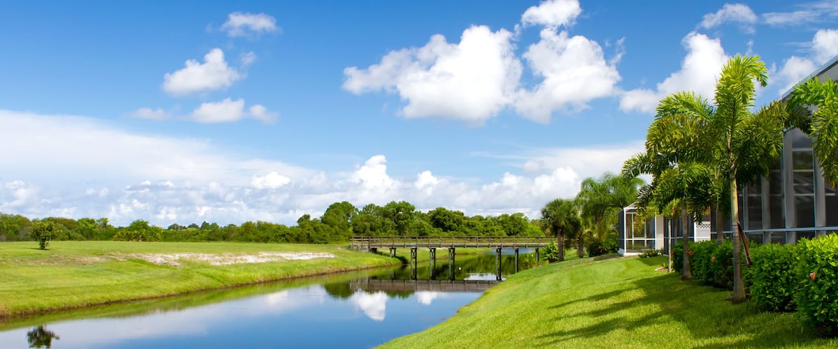 Freshwater canal at the rear of residential homes in Rotonda, Florida on a bright sunny day; Shutterstock ID 151134359