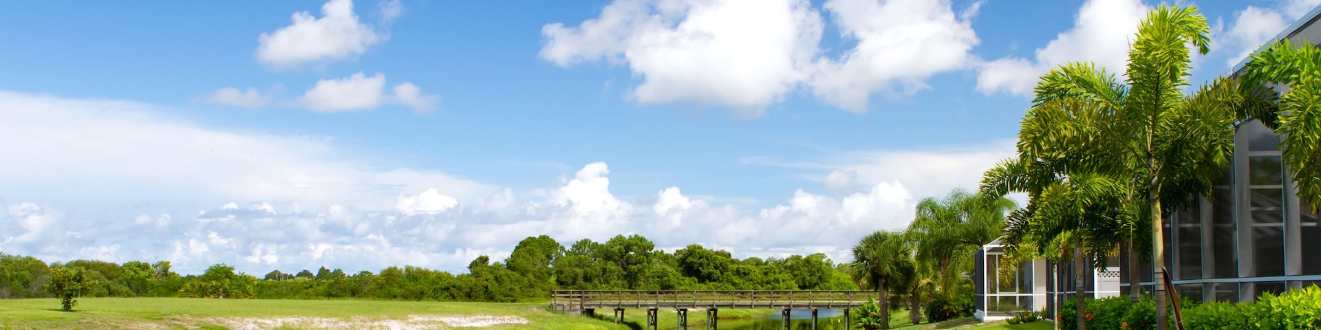 Freshwater canal at the rear of residential homes in Rotonda, Florida on a bright sunny day; Shutterstock ID 151134359