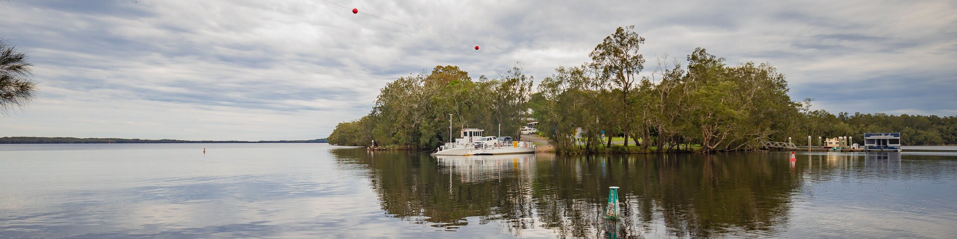 The Bombah Point Ferry carrying a vehicle across water