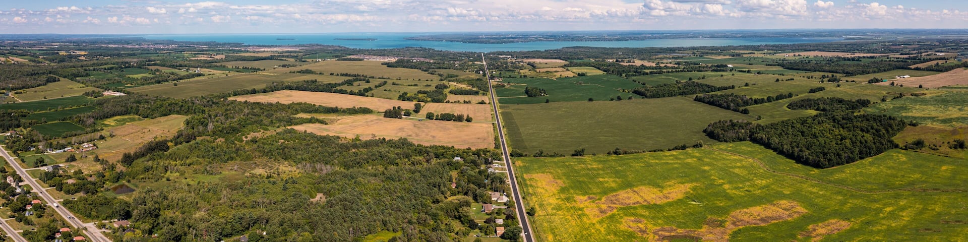 Innisfil water front beach shore line with farm land and lake simco in view