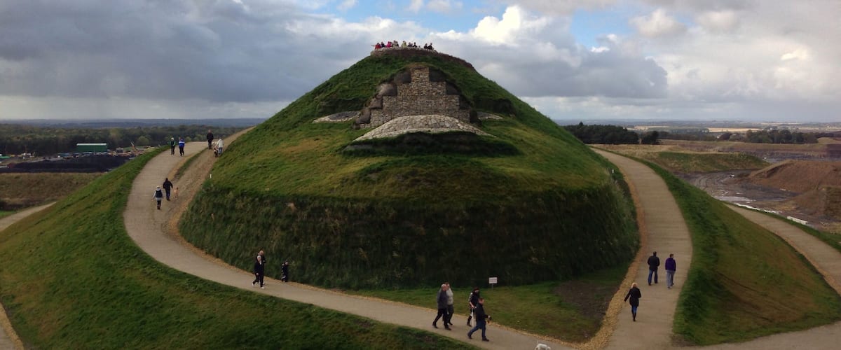 The face of the Northumberlandia land form sculpture, showing her lips, the underside of her nose, eyes and forehead.